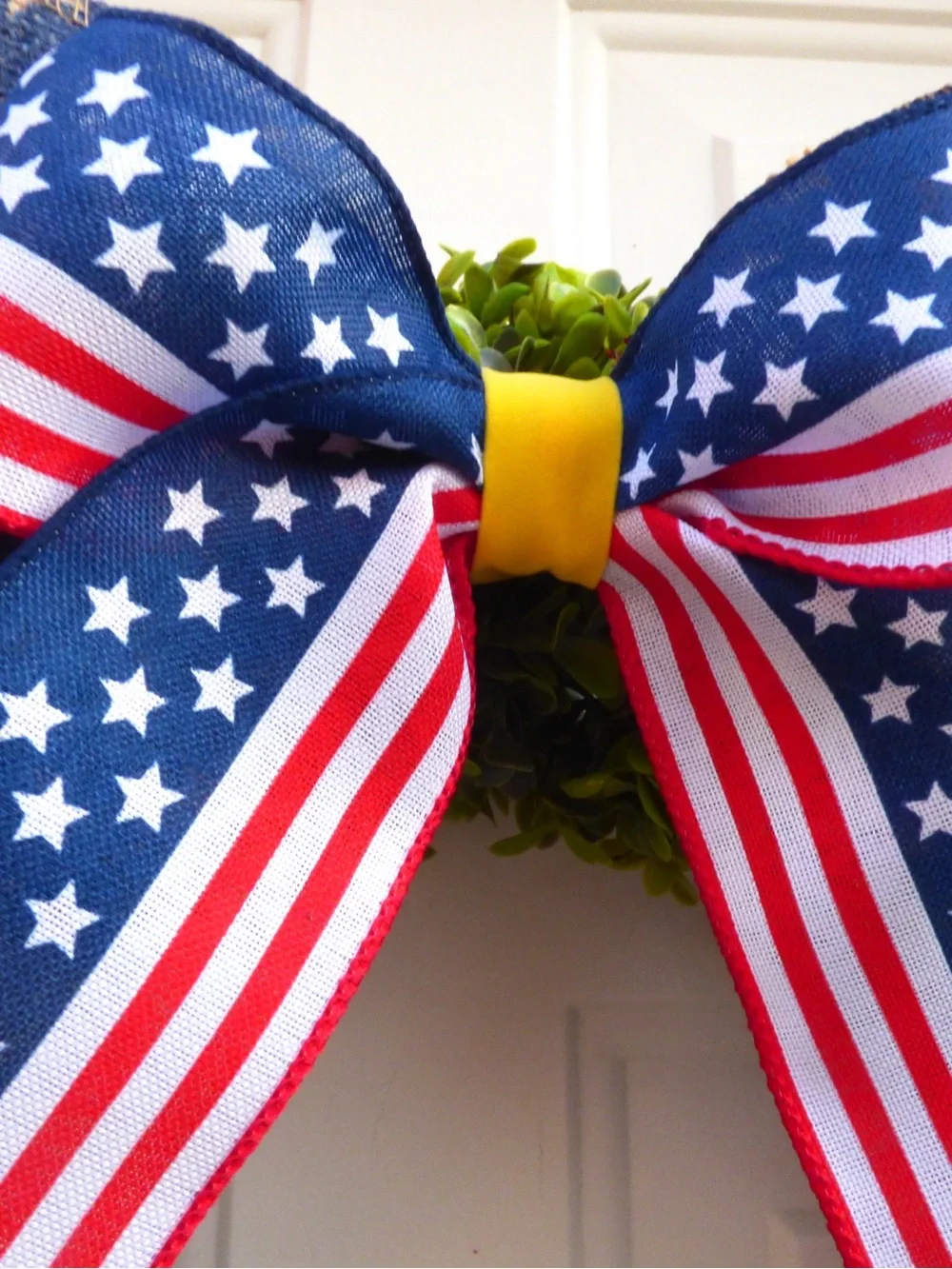 Patriotic Green Boxwood Wreath with Red White Blue Stars and Bow
